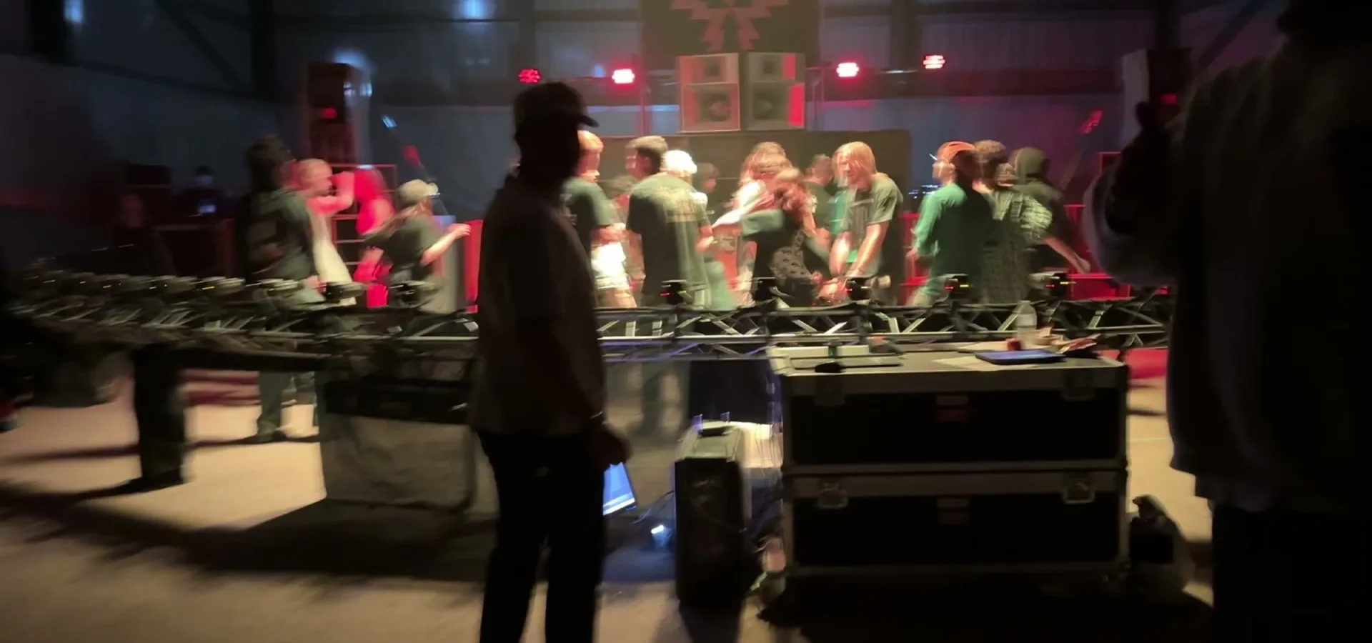 The barn set under red light, with the Argus rig and crew in silhouette