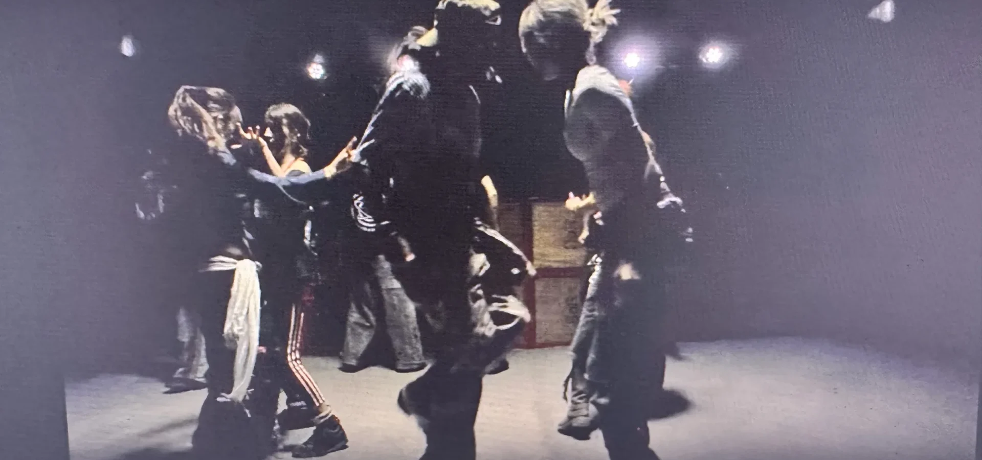 The crowd in motion on the barn set during a take