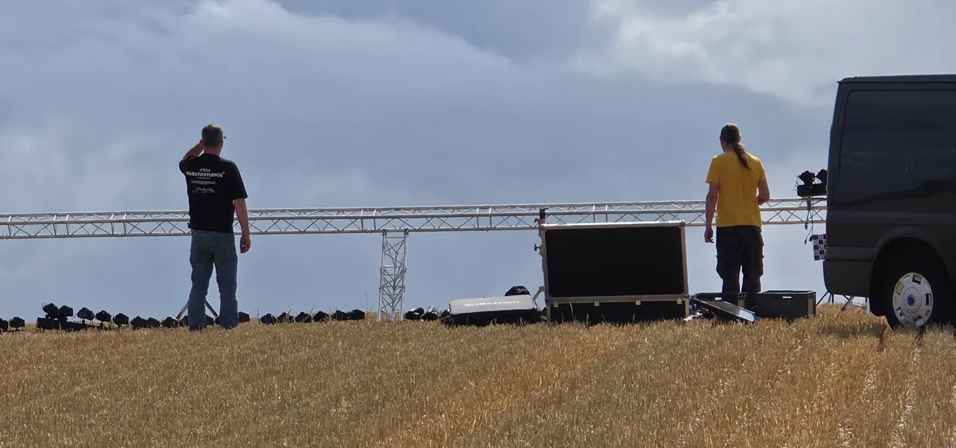 A row of Canon stills cameras along the truss, with Tom and Ian working at the far end